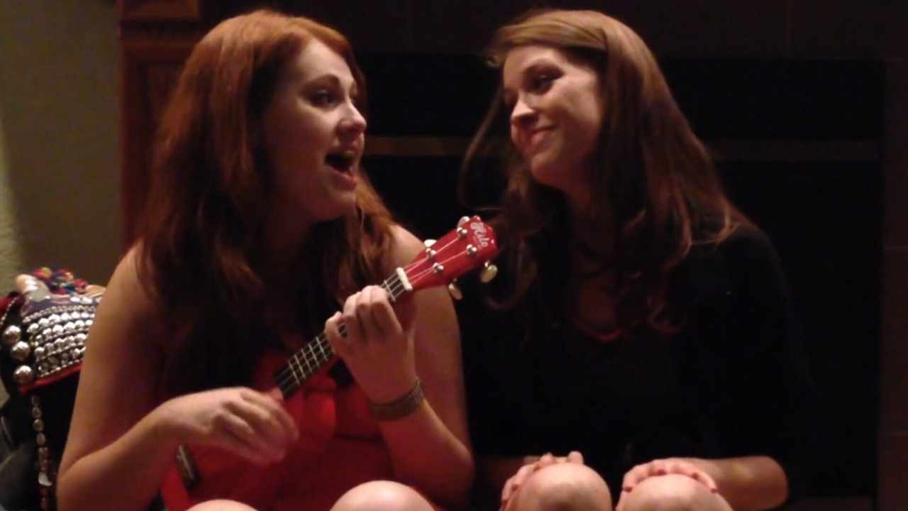 two women with a guitar